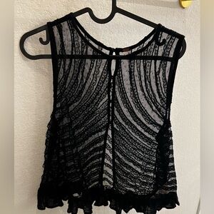 Free people black lace top with button down detail.